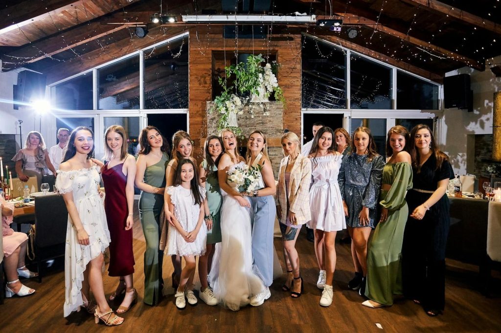 bride and guests posing for picture